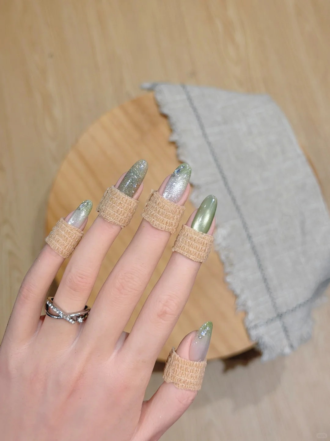Long almond nails with green and silver holographic glitter